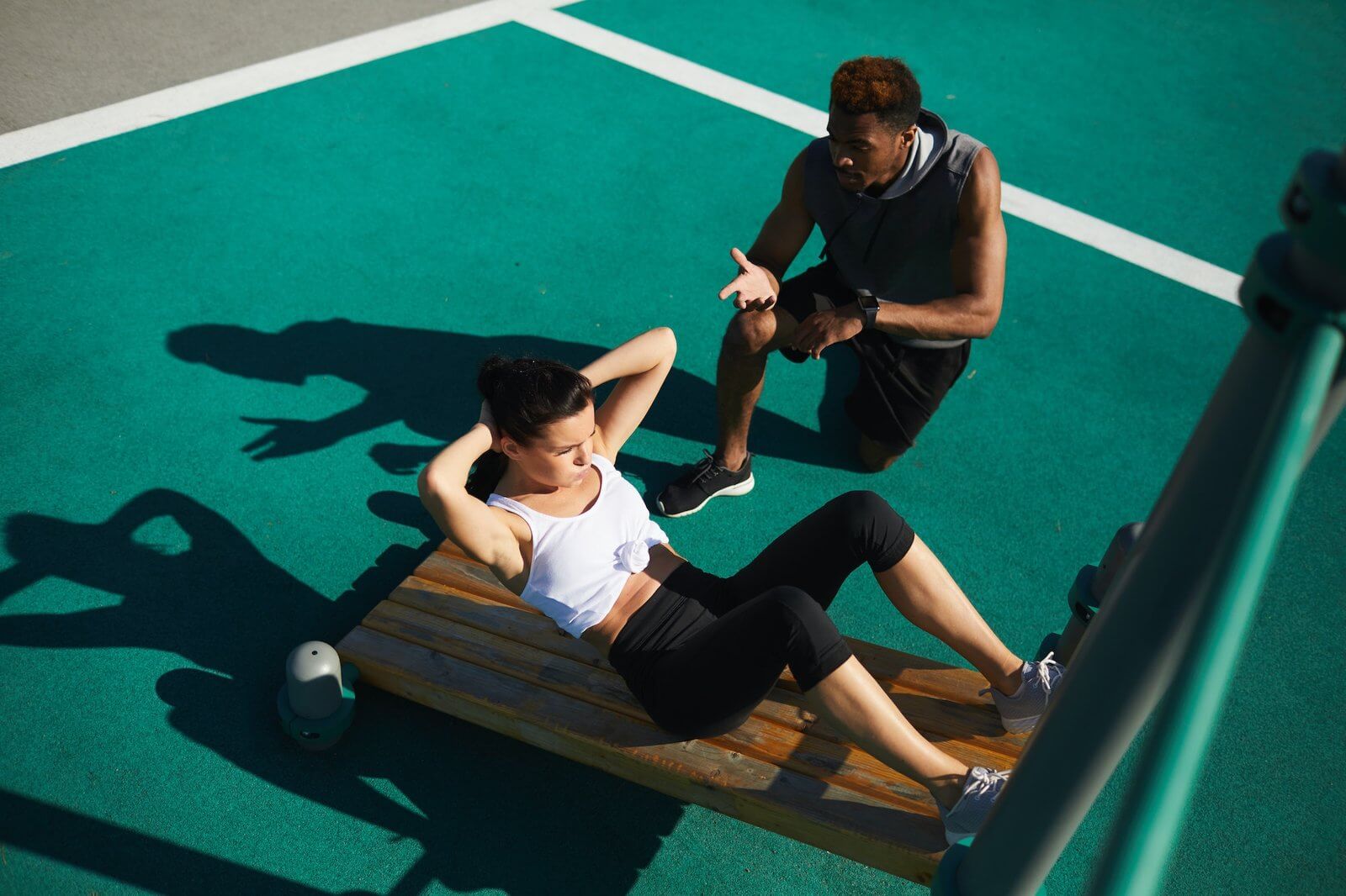 fitness-trainer-giving-advice-to-woman.jpg